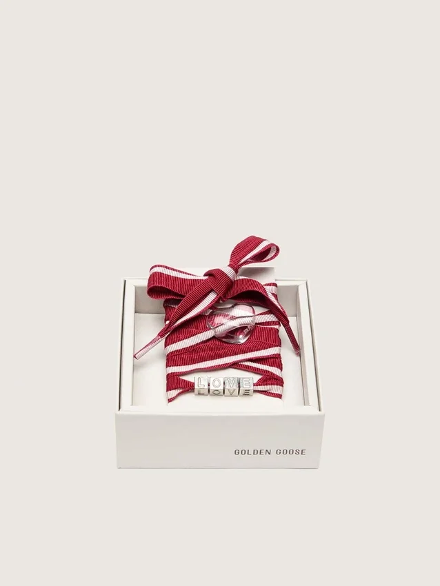 Lacets « Peaux » rayés rouges et blancs avec breloques