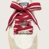 Lacets « Peaux » rayés rouges et blancs avec breloques