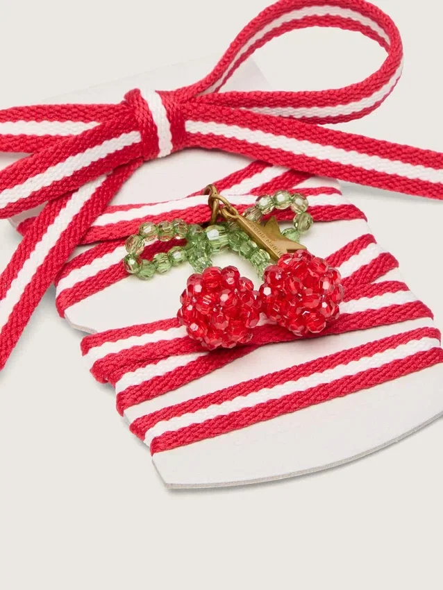 Lacets « Peaux » rouges et blancs avec breloque en forme de cerise