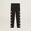 Leggings noirs pour filles avec des étoiles blanches sur les côtés