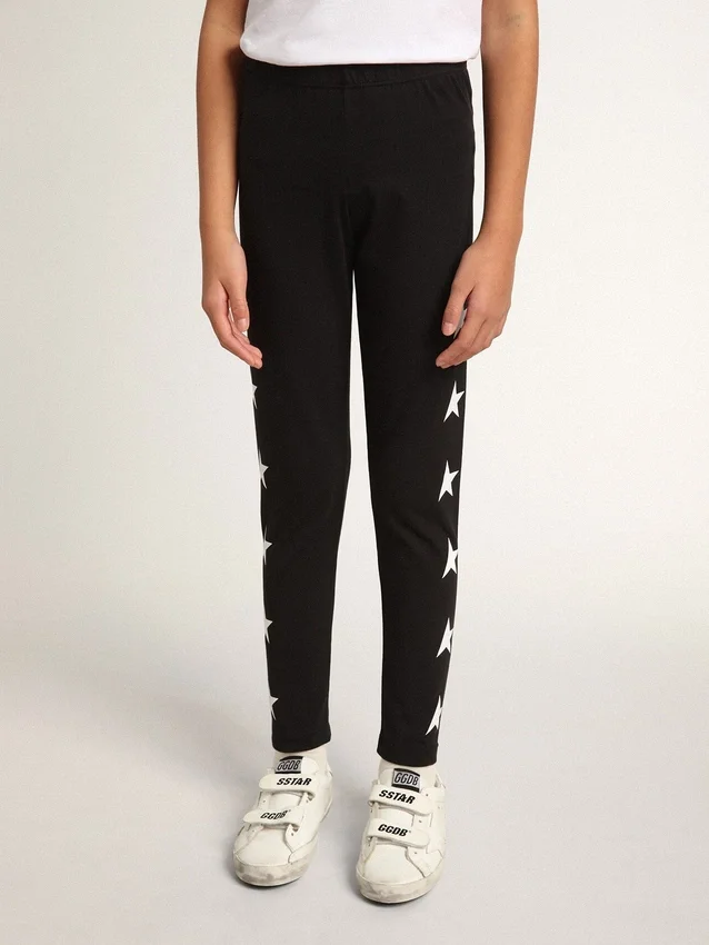 Leggings noirs pour filles avec des étoiles blanches sur les côtés