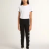 Leggings noirs pour filles avec des étoiles blanches sur les côtés