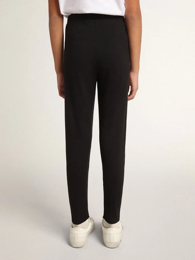 Leggings noirs pour filles avec des étoiles blanches sur les côtés
