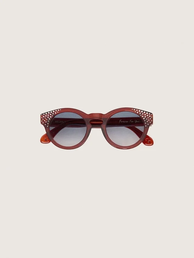Lunettes de soleil Cameron Panthos avec monture couleur miel, pierres précieuses et verres bleus