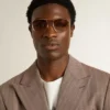 Lunettes de soleil de style aviateur avec monture dorée et verres beiges