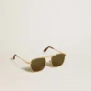Lunettes de soleil de style aviateur avec monture dorée et verres verts