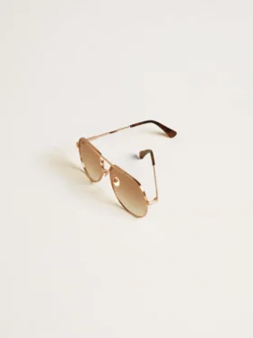 Lunettes de soleil de style aviateur avec monture en or rose et verres couleur miel
