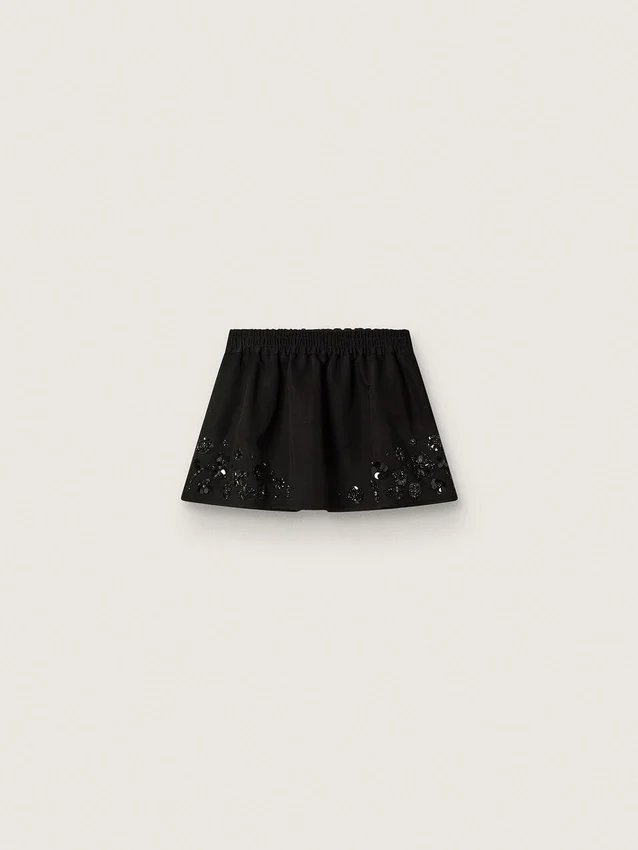 Mini-jupe pour femme en sergé de coton noir avec broderie florale en paillettes