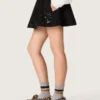 Mini-jupe pour femme en sergé de coton noir avec broderie florale en paillettes