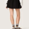 Mini-jupe pour femme en sergé de coton noir avec broderie florale en paillettes