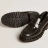 Mocassins épais pour femme en cuir noir clouté