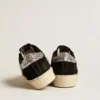 Modèle Hi Star pour femme en cuir noir avec languette de talon à paillettes argentées