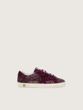 Modèle Old School junior en suède pailleté bordeaux avec étoile et languette au talon en daim bordeaux