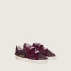 Modèle Old School junior en suède pailleté bordeaux avec étoile et languette au talon en daim bordeaux
