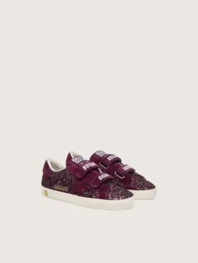 Modèle Old School junior en suède pailleté bordeaux avec étoile et languette au talon en daim bordeaux