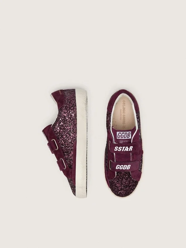 Modèle Old School junior en suède pailleté bordeaux avec étoile et languette au talon en daim bordeaux