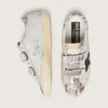 Modèle Old School pour femme en cuir blanc avec étoile en cuir noir et empiècements imprimé serpent