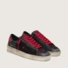 Modèle Stardan pour homme en cuir noir avec étoile rouge, empiècements en mesh noir et en cuir rouge