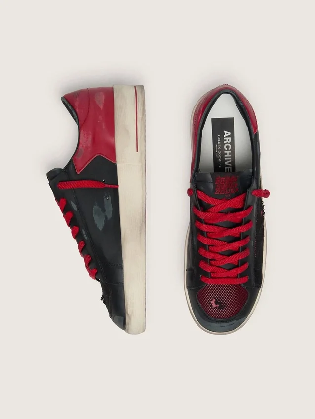Modèle Stardan pour homme en cuir noir avec étoile rouge, empiècements en mesh noir et en cuir rouge