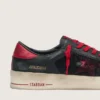 Modèle Stardan pour homme en cuir noir avec étoile rouge, empiècements en mesh noir et en cuir rouge