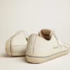 Modèle V-Star pour homme en cuir blanc avec une étoile blanche et une bande bleu clair sur le renfort
