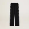 Pantalon de jogging noir pour femme avec des étoiles blanches sur les côtés