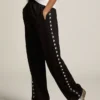 Pantalon de jogging noir pour femme avec des étoiles blanches sur les côtés