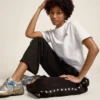 Pantalon de jogging noir pour femme avec des étoiles blanches sur les côtés