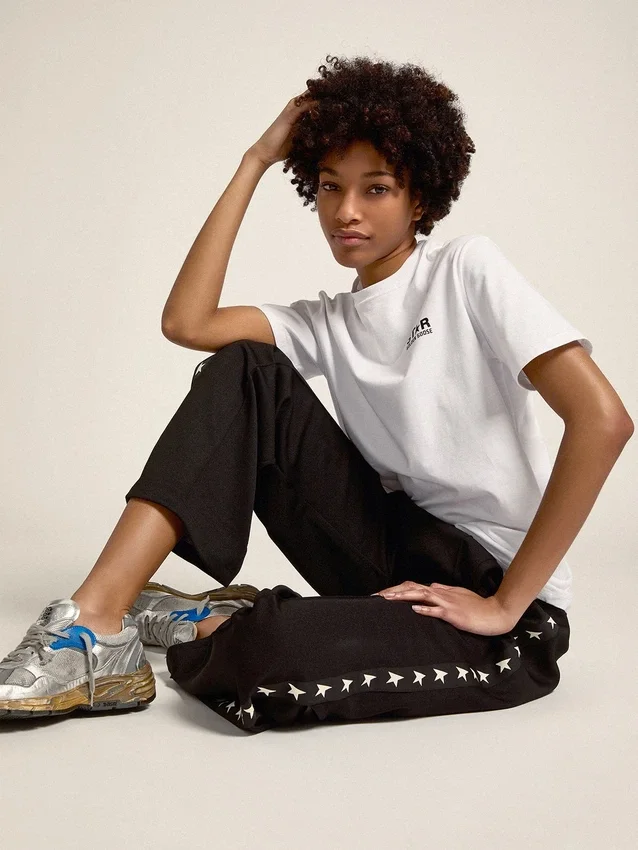 Pantalon de jogging noir pour femme avec des étoiles blanches sur les côtés