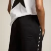 Pantalon de jogging noir pour femme avec des étoiles blanches sur les côtés