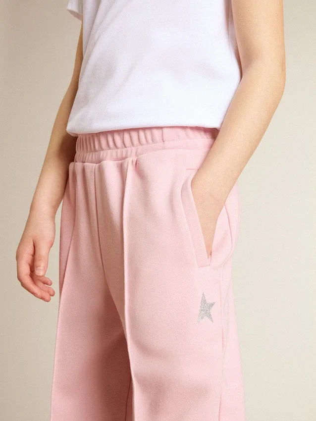 Pantalon de jogging rose avec une étoile pailletée sur le devant