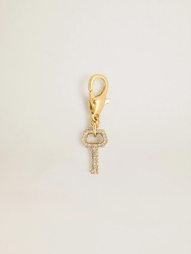 Pendentif en forme de clé en laiton doré orné de cristaux