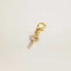 Pendentif en forme de clé en laiton doré orné de cristaux