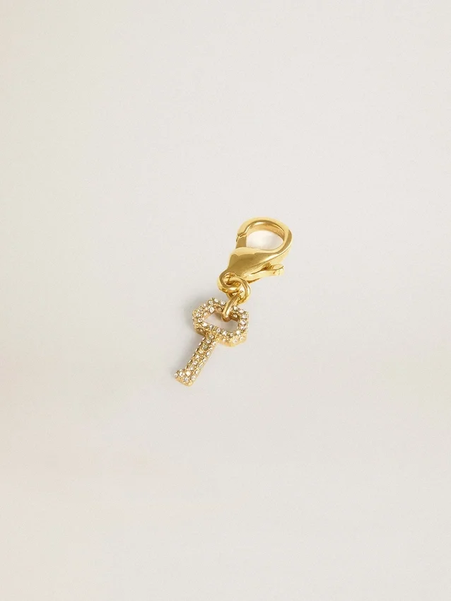 Pendentif en forme de clé en laiton doré orné de cristaux