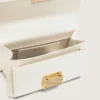 Petit sac Venezia en cuir gaufré couleur beurre avec détails dorés