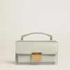 Petit sac Venezia en cuir grainé gris minéral avec détails dorés