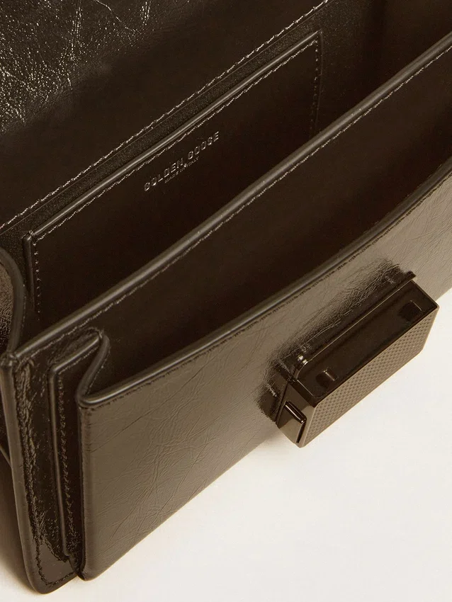 Petit sac Venezia en cuir métallisé noir avec détails noirs