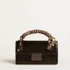 Petit sac Venezia en cuir métallisé noir avec détails noirs