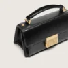 Petit sac Venezia en cuir noir gaufré avec détails dorés