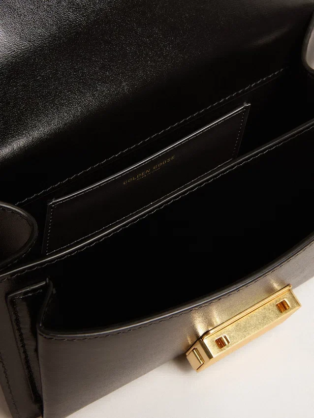 Petit sac Venezia en cuir noir gaufré avec détails dorés