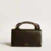 Petit sac Venezia en cuir noir rigide avec foulard en soie