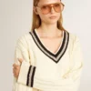 Pull court pour femme à motif torsadé, avec bords-côtes bleus et cristaux