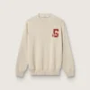 Pull unisexe à col rond en coton beige, avec un patch sur le devant et un logo dans le dos