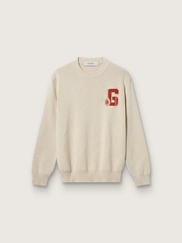 Pull unisexe à col rond en coton beige, avec un patch sur le devant et un logo dans le dos