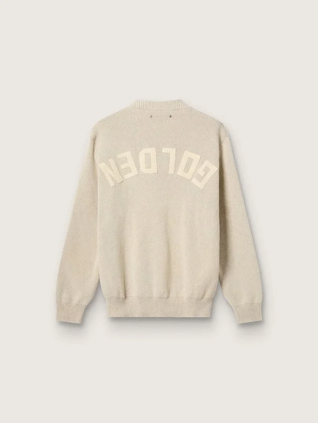 Pull unisexe à col rond en coton beige, avec un patch sur le devant et un logo dans le dos