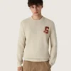 Pull unisexe à col rond en coton beige, avec un patch sur le devant et un logo dans le dos
