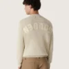 Pull unisexe à col rond en coton beige, avec un patch sur le devant et un logo dans le dos