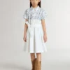 Robe-chemise pour fille en toile de coton blanche avec un imprimé nautique bleu et un passepoil blanc