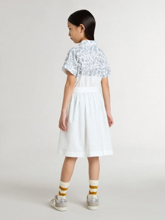 Robe-chemise pour fille en toile de coton blanche avec un imprimé nautique bleu et un passepoil blanc