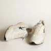 Running Sole en cuir blanc et mesh avec étoile en cuir laminé bleu